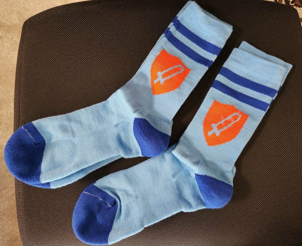 Blue socks with the orange take this logo